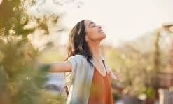 Woman feeling free and present - intuitive eating mindset